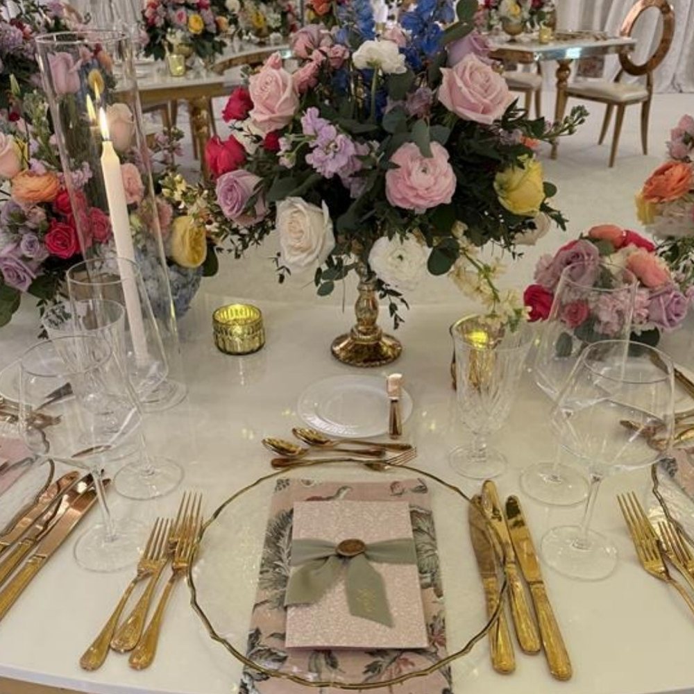 Garden tablescape with gold flatware