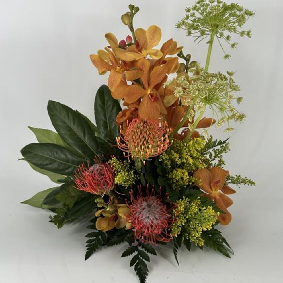Orchid, protea & rose centerpiece