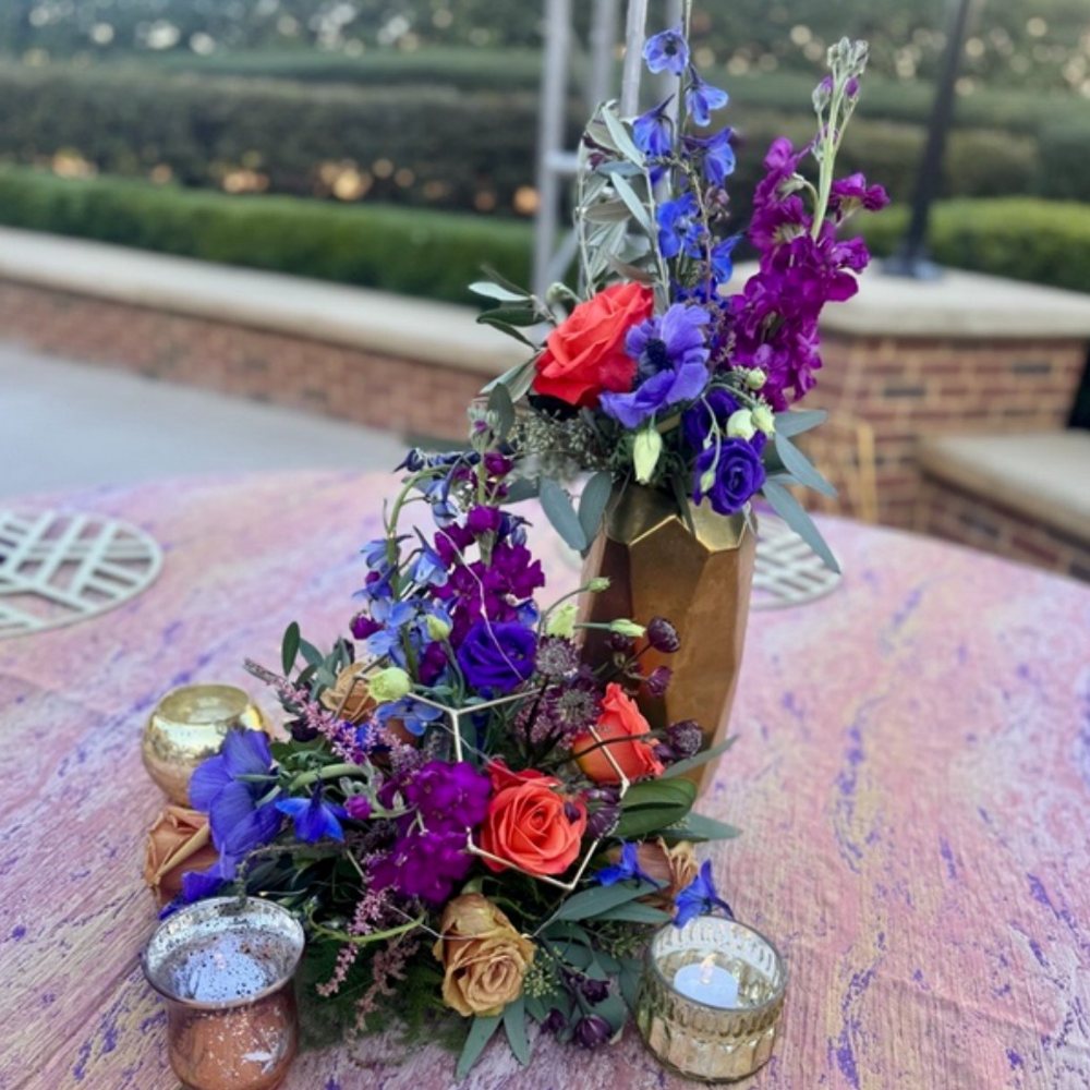 Purple delphinium gold-vase centerpiece
