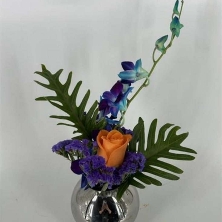 Tropical foliage & orchid accent