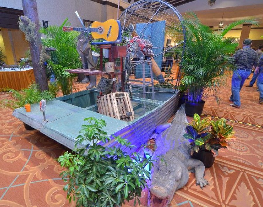 Alligator statue among tropical foliage