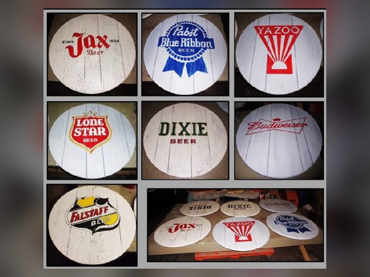 Cocktail table tops painted with vintage beer labels