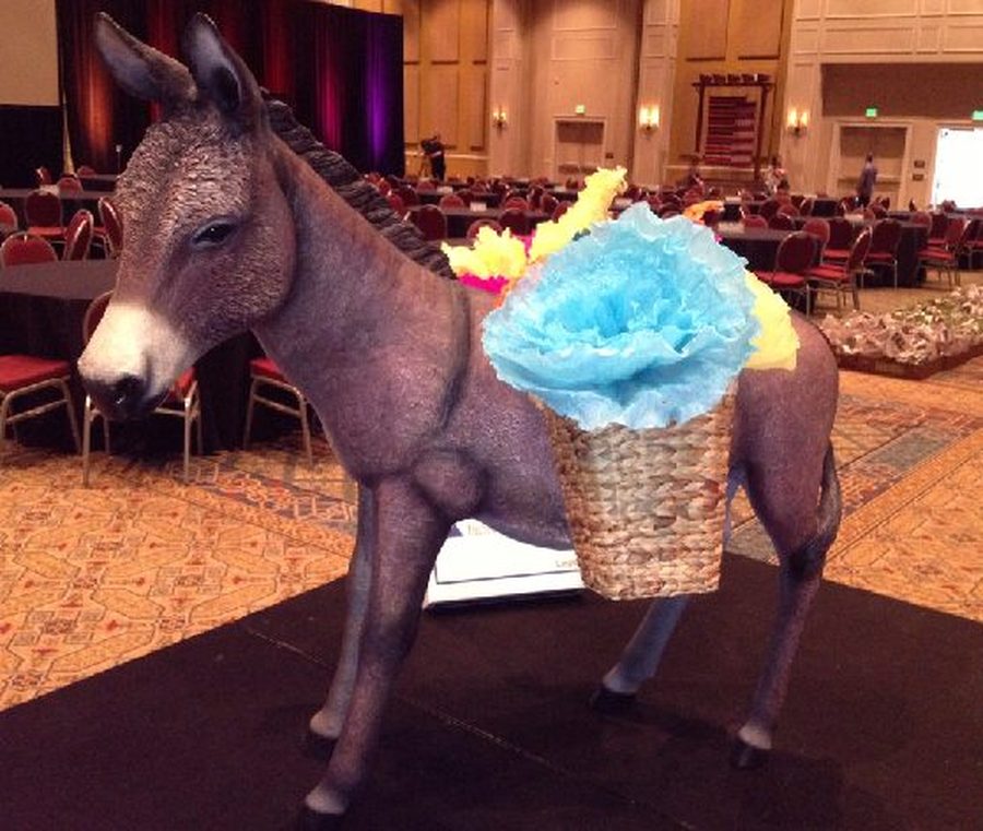 Life-size donkey statue with floral basket