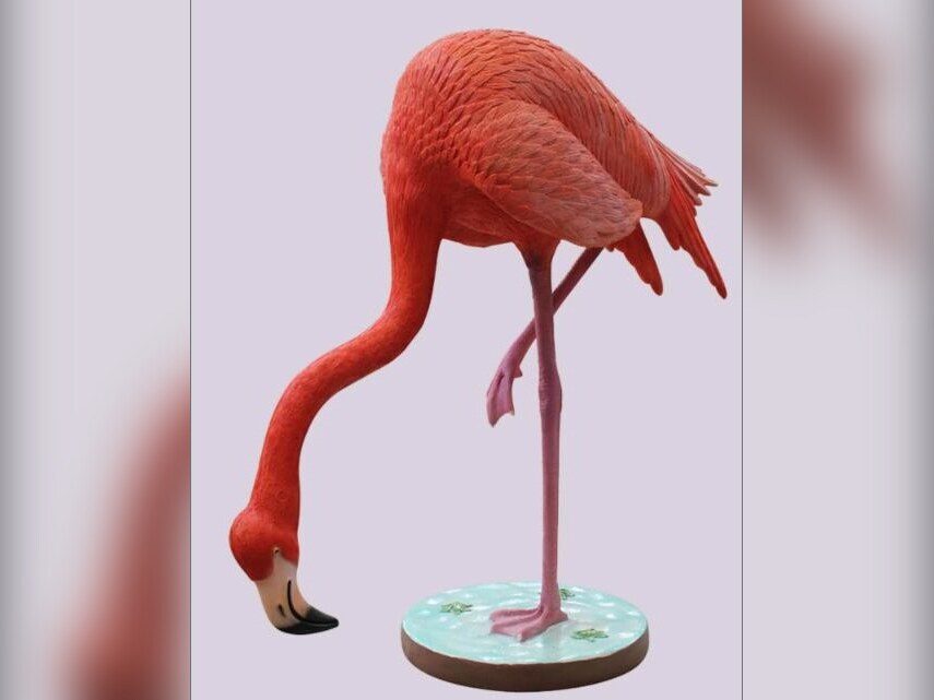 Flamingo statue with head lowered