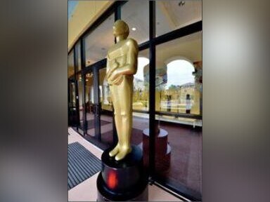 Oversized gold award statue