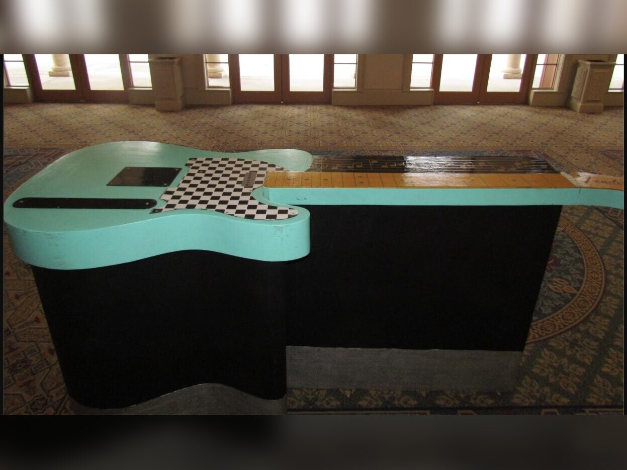 Guitar-shaped bar