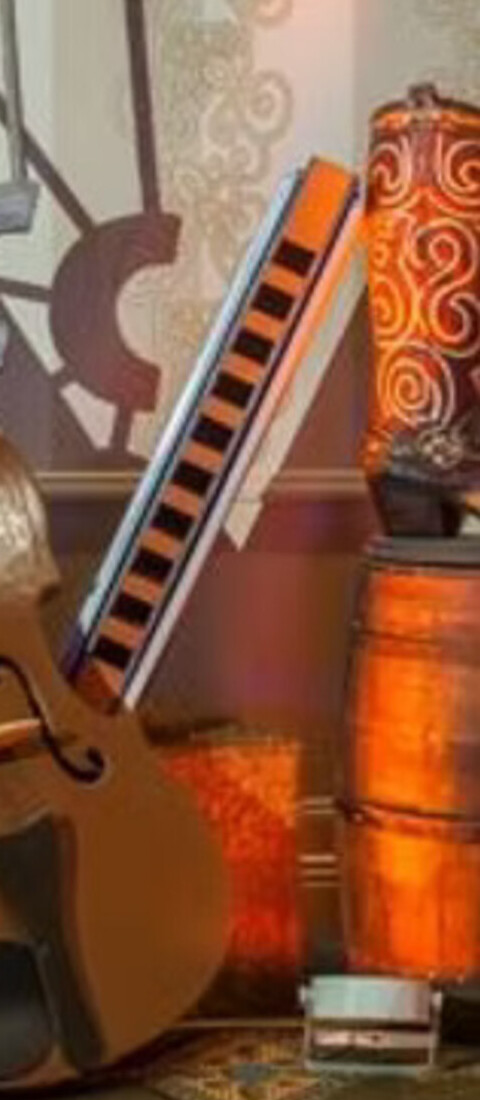 Oversized harmonica prop with fiddle and barrels