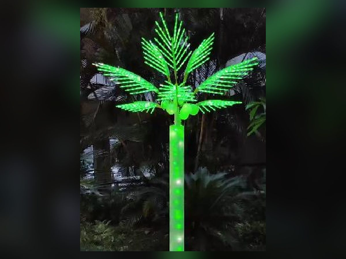 LED lighted palm tree glowing green