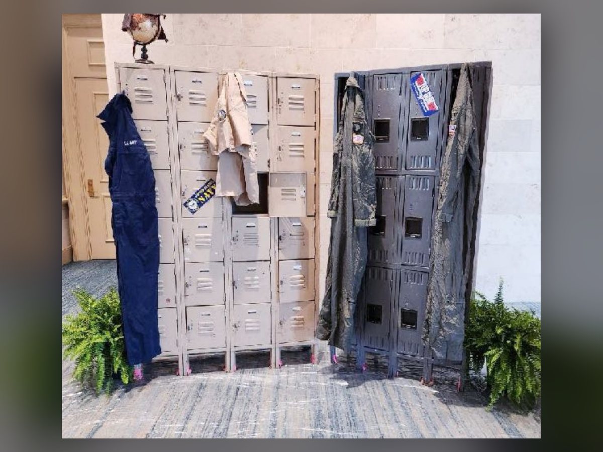 Sports locker room vignette with bench and pennants