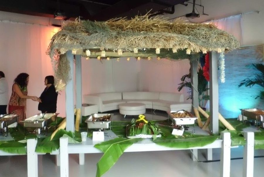 Thatched luau buffet with tropical florals