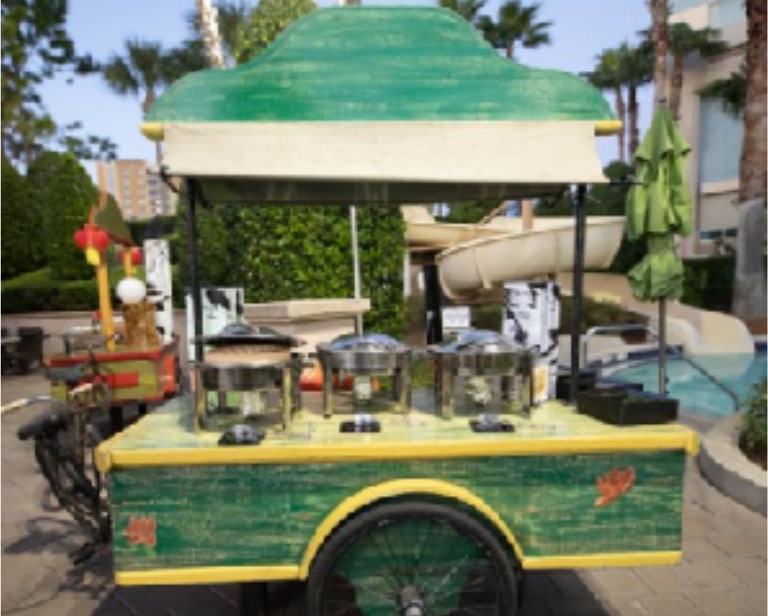Green and yellow multi-use vendor cart with chafing dishes