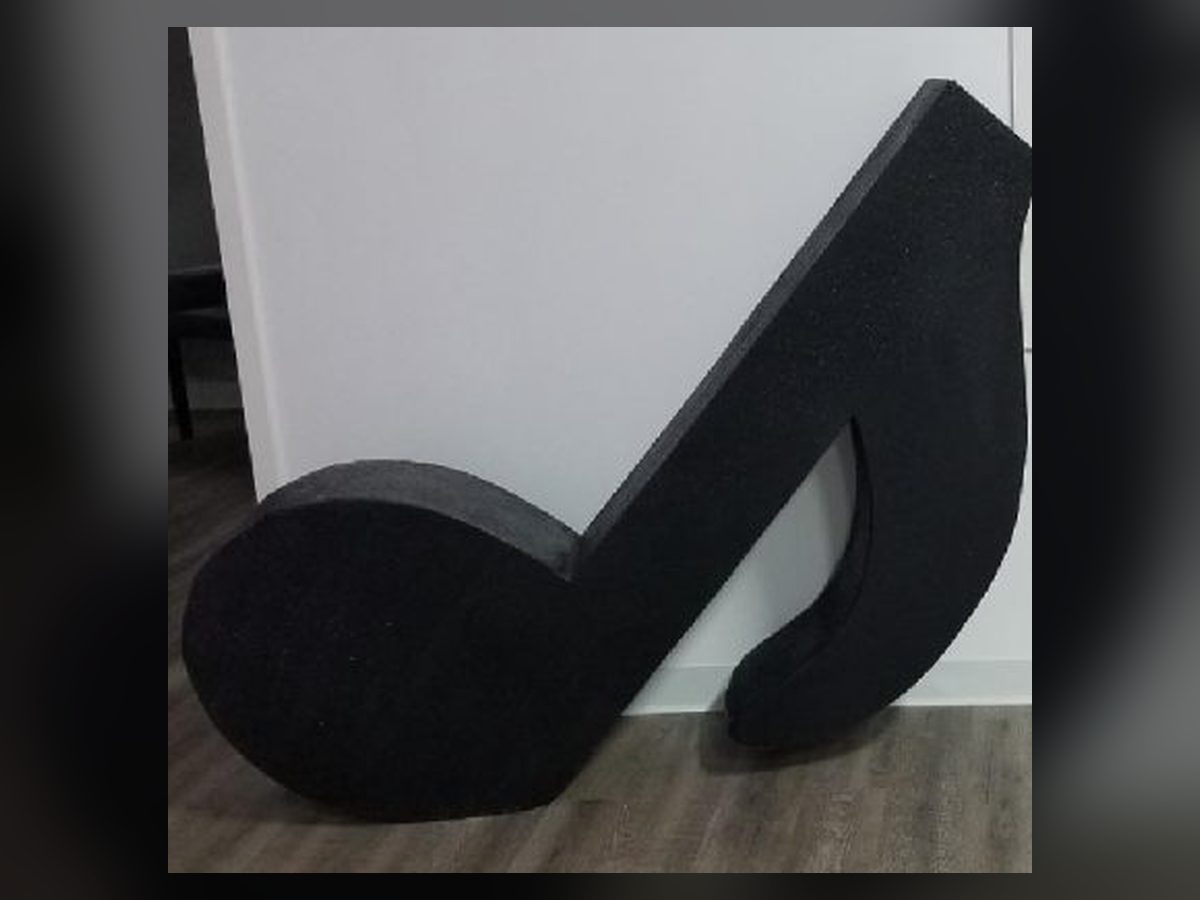 Oversized black musical note props