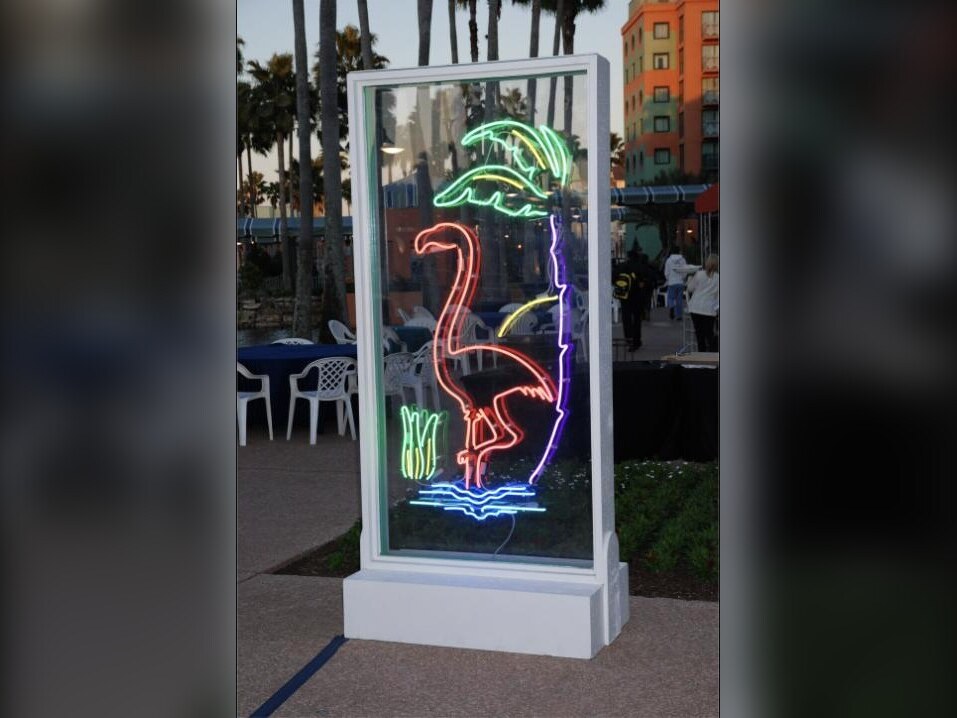 Neon flamingo sign in a lighted case