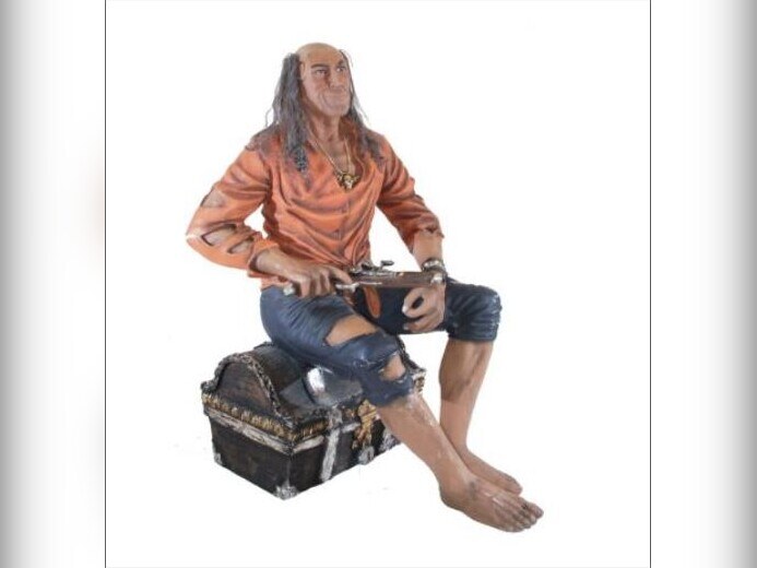 Seated pirate statue playing a mandolin