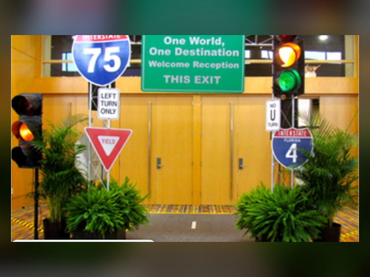 Road trip entry with highway signs and traffic light