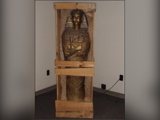 Egyptian sarcophagus statue in wooden crate