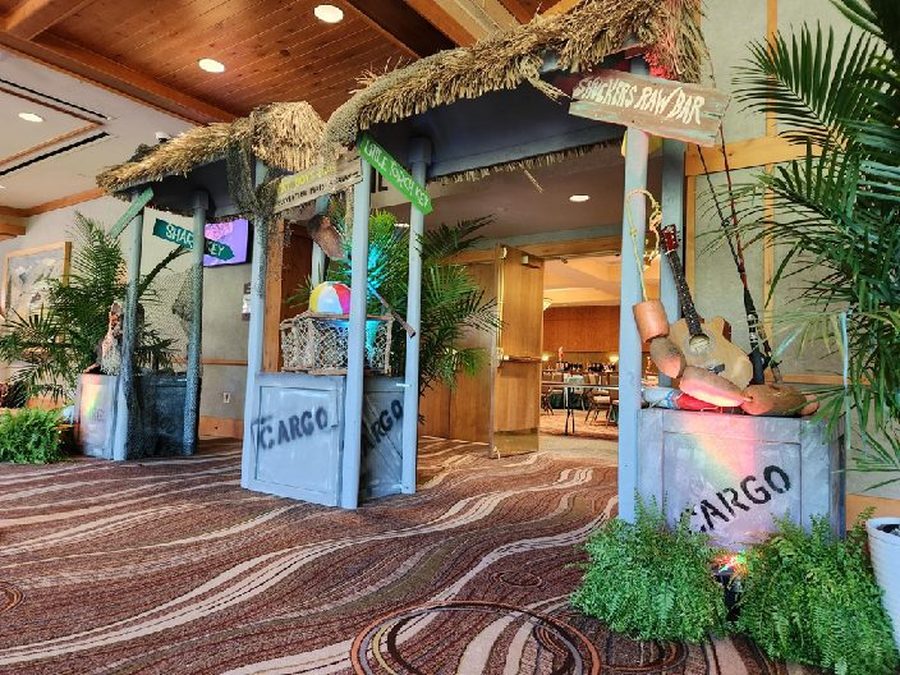 Tropical island entry with thatch, palms and parrot